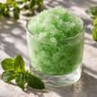 Granité vert menthe aux cristaux de glace visibles, avec des feuilles de menthe — illustration du parfum
